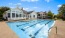 a swimming pool in front of a house