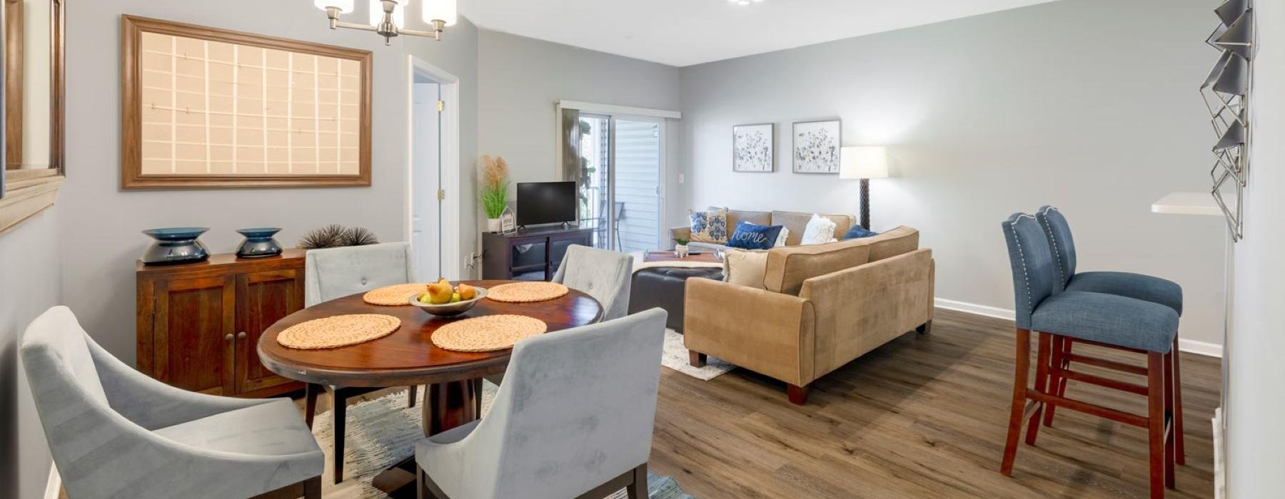 a living room with a table and chairs