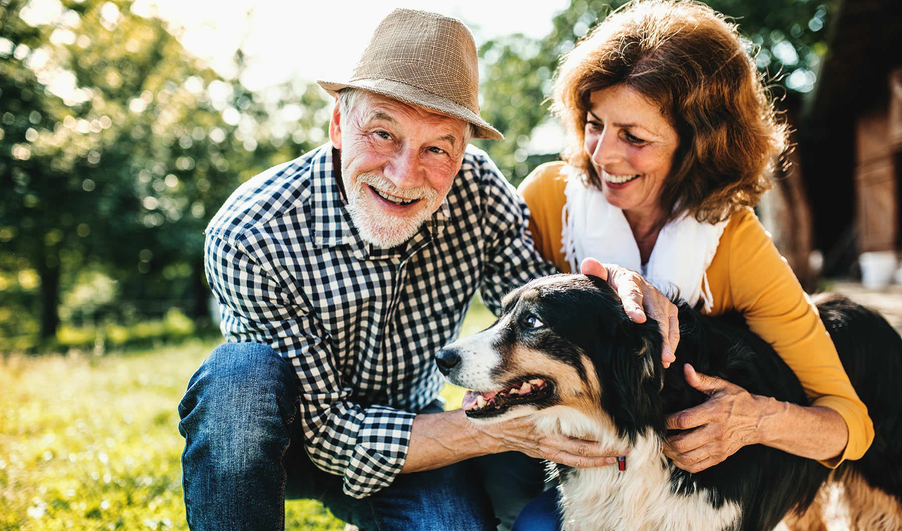 Discover 55+ Active Adult Living in Langhorne couple outside with their dog