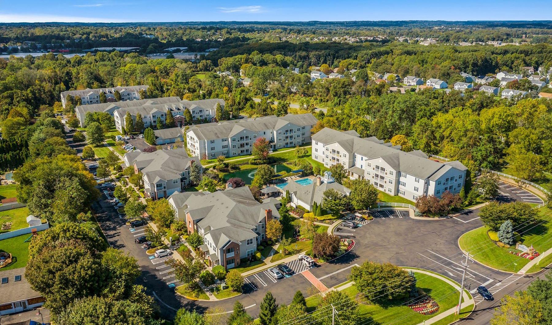 Settle into comfort at HeatherGate at Oxford Valley a large building surrounded by trees